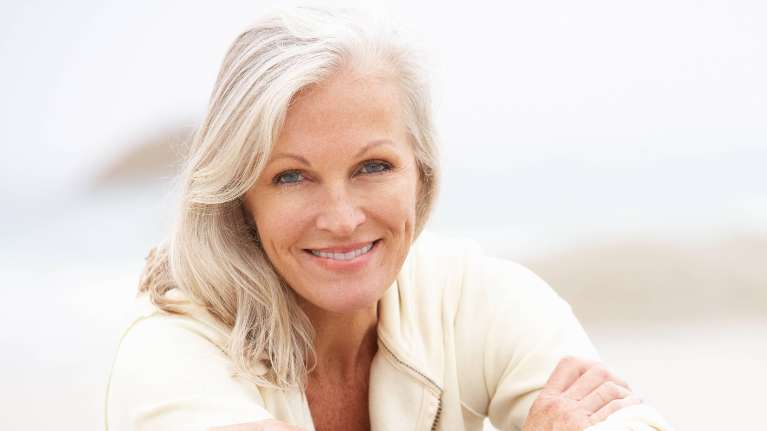 A woman with veneers smiling