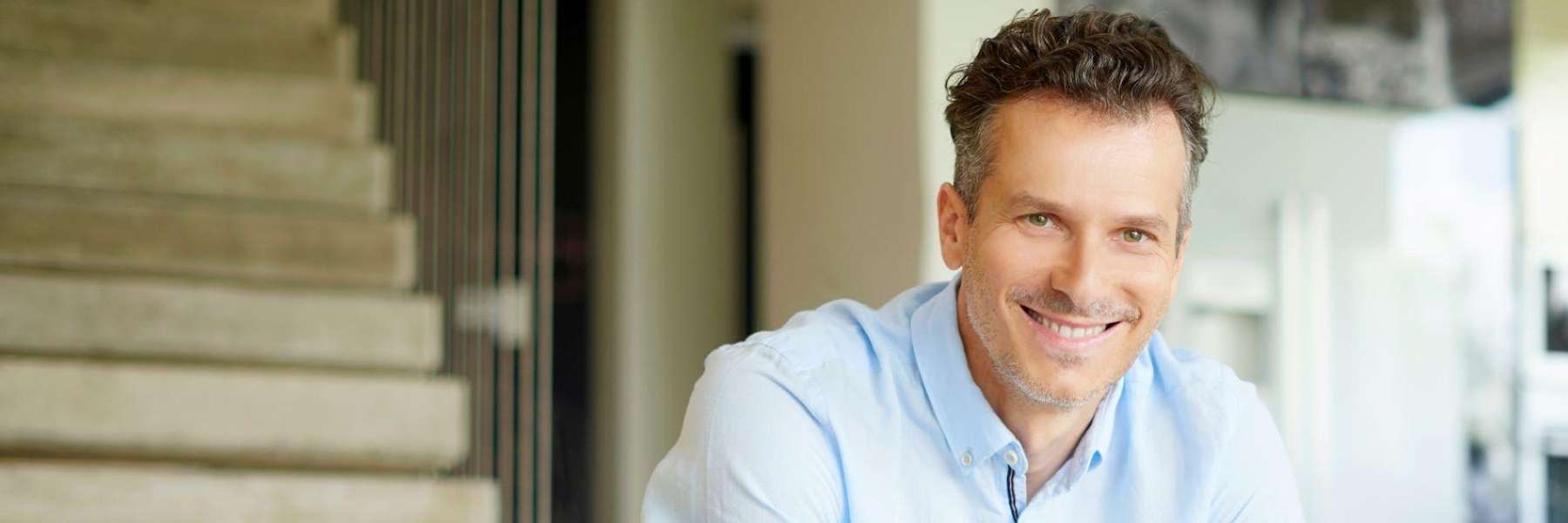 A man smiling at home | Winchester KY dentist