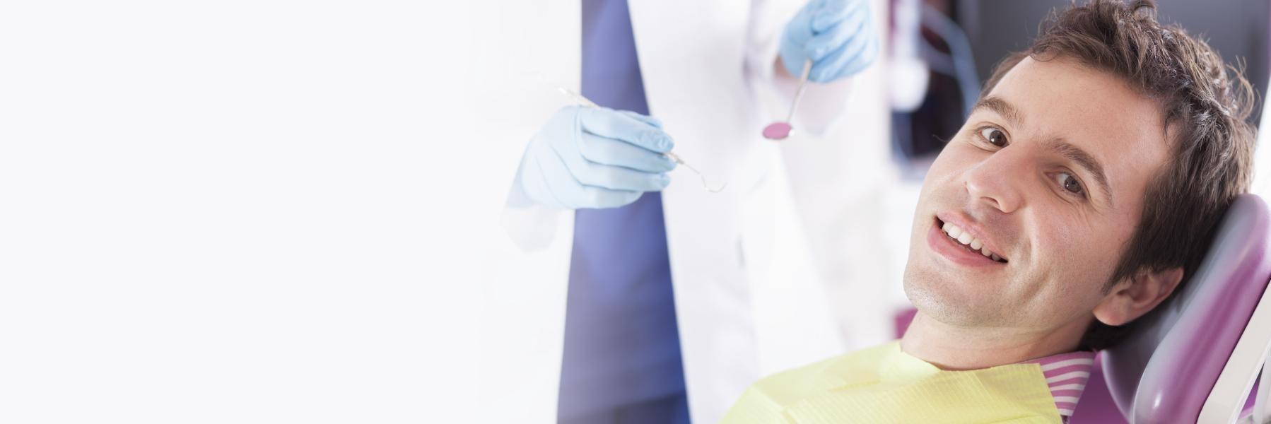 guy smiling after root canal recovery